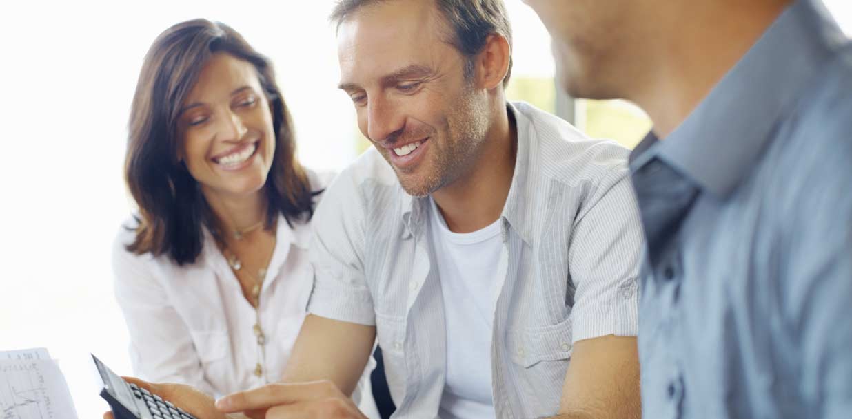 Mature couple discussing financial matter with advisor